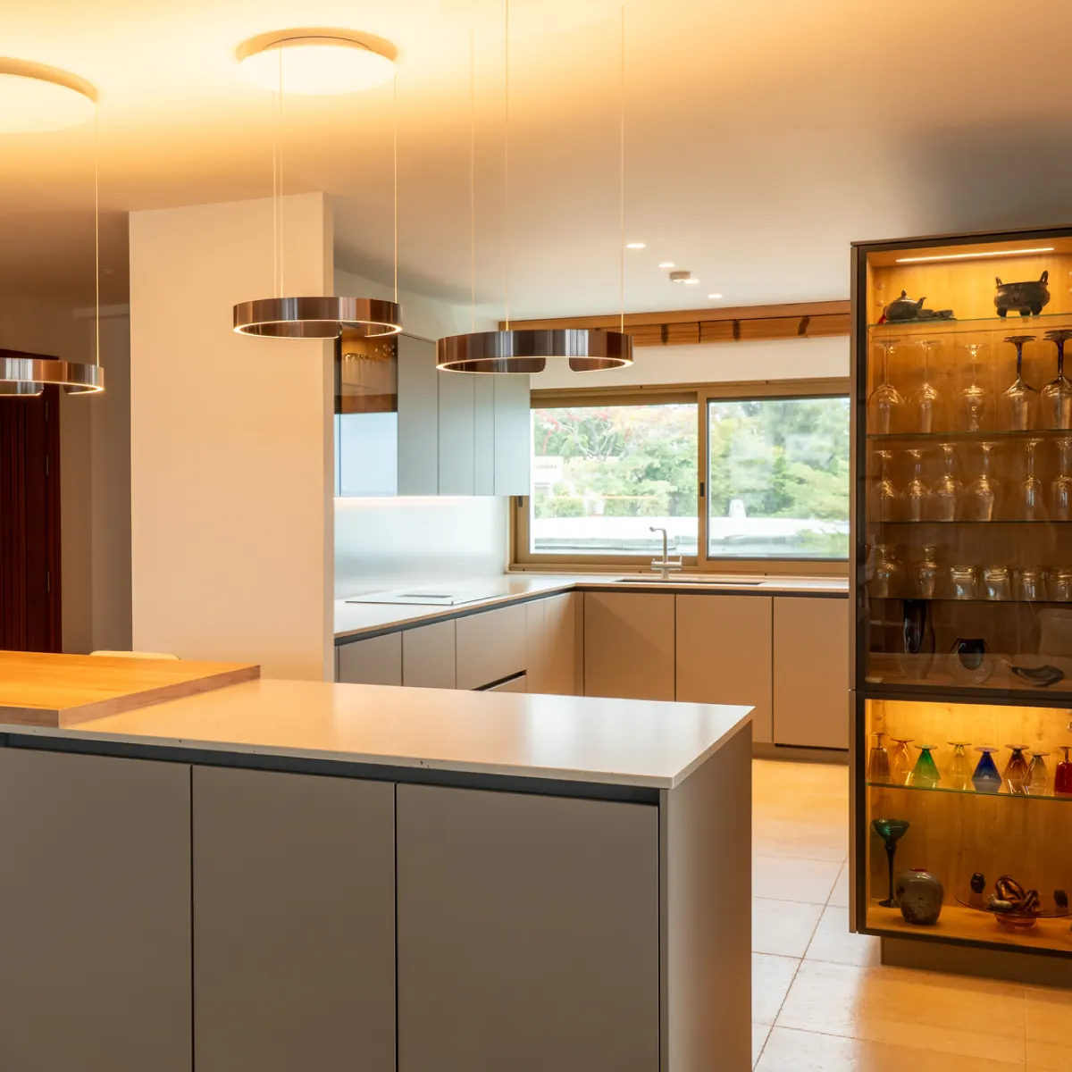 Warm wood-textured kitchen flowing into the living area