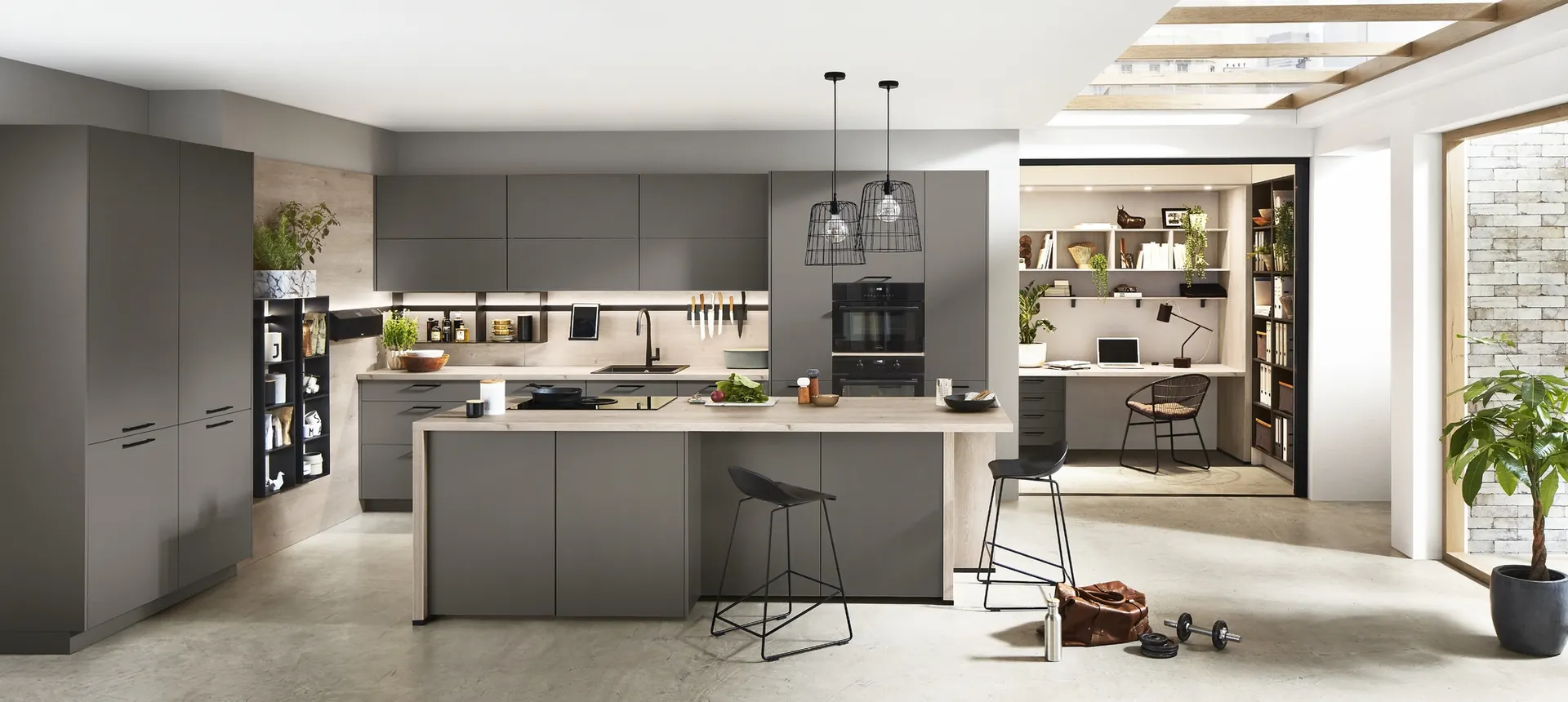 Designer kitchen with a large island and an integrated home office wall