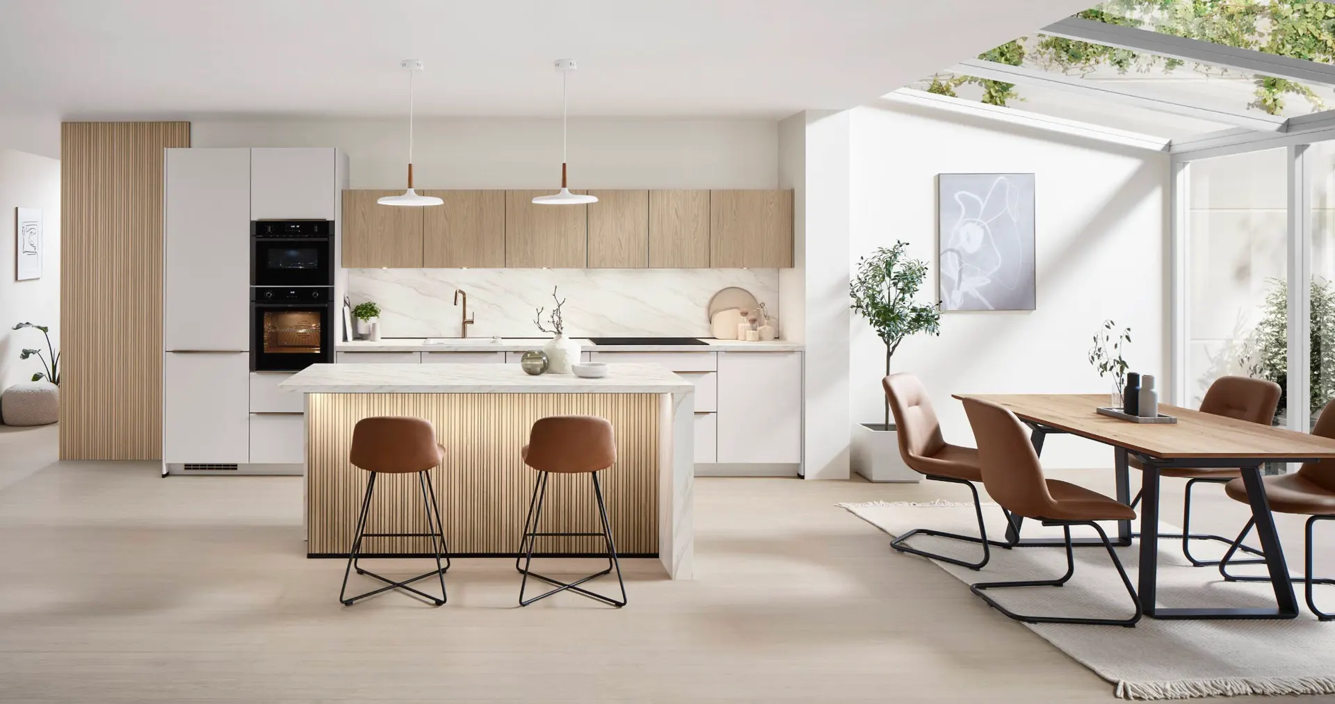 Bright kitchen in white and warm wood with slatted island detailing