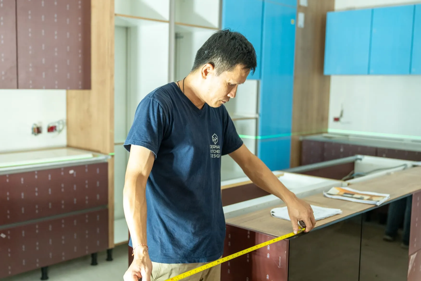 The in-house installation team fitting a kitchen