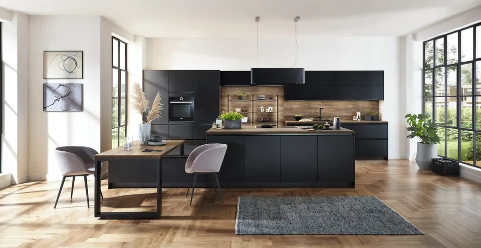 Matte black handleless kitchen with a matching island
